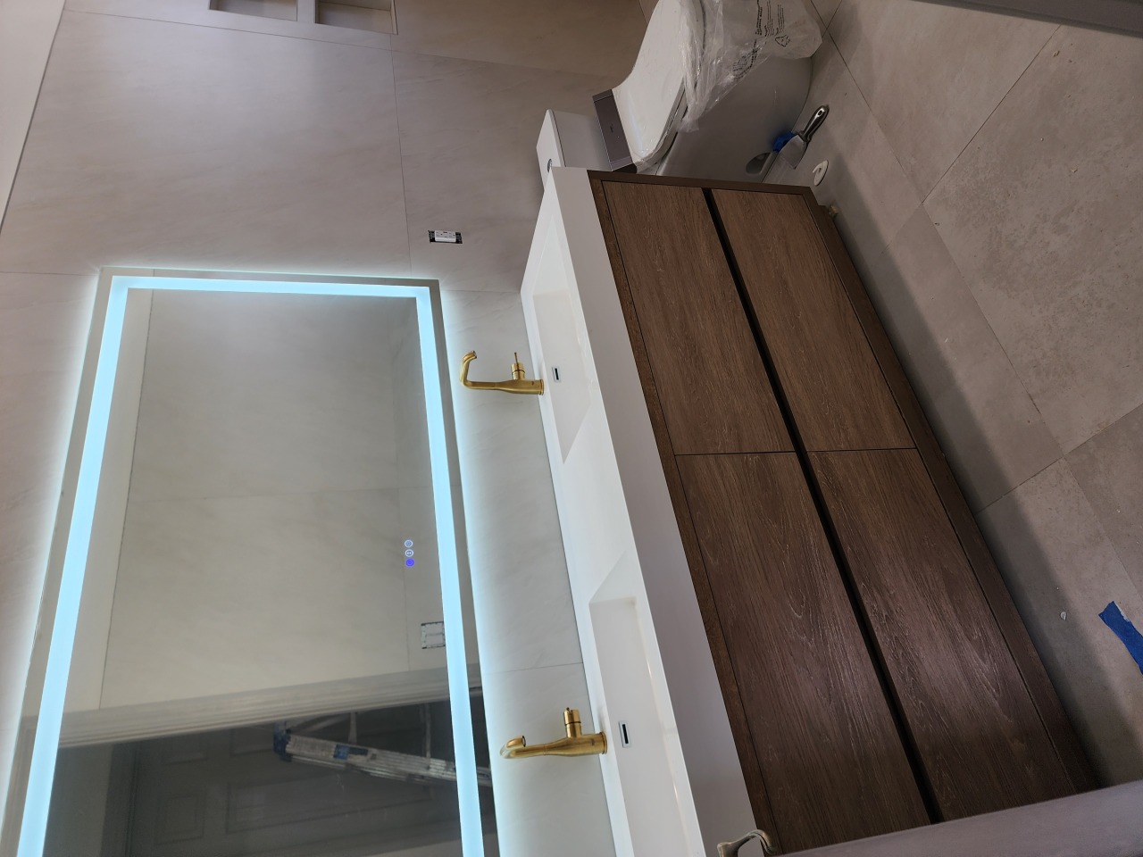 Bathroom remodel with vanity and tile walls